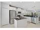 Bright kitchen features stainless appliances, white cabinets, and granite countertops at 12689 Sagewood Dr, Venice, FL 34293