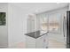 Bright kitchen featuring white cabinets and stainless appliances at 12689 Sagewood Dr, Venice, FL 34293