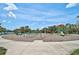 Community playground featuring slides, climbing structures, and shaded seating areas for families to enjoy at 12689 Sagewood Dr, Venice, FL 34293