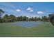 Community tennis court with shade structure at 12689 Sagewood Dr, Venice, FL 34293