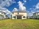 Large backyard featuring lush grass, and black metal fence, surrounding the perimeter at 12705 Pinnacle Ln, Venice, FL 34293