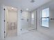 A bathroom features a glass walk-in shower and a toilet at 12705 Pinnacle Ln, Venice, FL 34293