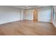 A large bedroom has hardwood floors, neutral paint, and tray ceilings at 12705 Pinnacle Ln, Venice, FL 34293