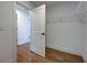 An open walk-in closet with white shelving and sleek, black hardware at 12705 Pinnacle Ln, Venice, FL 34293