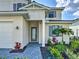 Elegant front entrance featuring well-manicured landscaping, and a brick paved walkway at 12705 Pinnacle Ln, Venice, FL 34293