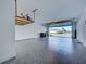 Clean two-car garage with epoxy flooring and storage rack at 12705 Pinnacle Ln, Venice, FL 34293