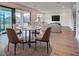 Well-designed living area featuring a dining table and chairs, seamlessly flowing into a comfortable seating area at 12705 Pinnacle Ln, Venice, FL 34293