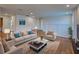 Living room features a sofa, two chairs, a coffee table, and an area rug at 12705 Pinnacle Ln, Venice, FL 34293