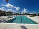 Stunning community pool featuring clear water and ample lounge seating at 12705 Pinnacle Ln, Venice, FL 34293