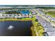 Aerial view of a lakeside community with well-maintained landscaping at 12816 Morning Mist Pl, Venice, FL 34293