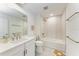 Modern bathroom featuring a bathtub, elegant fixtures, a stylish vanity, and a sleek design at 12816 Morning Mist Pl, Venice, FL 34293