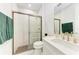Modern bathroom features glass shower, tiled walls, and marble countertops at 12816 Morning Mist Pl, Venice, FL 34293
