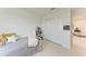Cozy bedroom with a neutral color scheme, a plush bed, and a closet with sliding doors at 12816 Morning Mist Pl, Venice, FL 34293