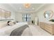 Relaxing main bedroom featuring ample natural light and tray ceiling at 12816 Morning Mist Pl, Venice, FL 34293