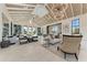 Spacious clubhouse interior with elegant furnishings, high ceilings, and abundant natural light at 12816 Morning Mist Pl, Venice, FL 34293