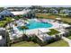 Resort-style community pool with lounge chairs, cabanas, and ample space for relaxation and recreation at 12816 Morning Mist Pl, Venice, FL 34293