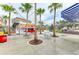 Community area featuring food trucks, seating, green space, and palm trees for gatherings and events at 12816 Morning Mist Pl, Venice, FL 34293
