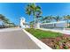 Elegant entrance to Solstice Wellen Park, showcasing lush landscaping and modern architectural design by Toll Brothers at 12816 Morning Mist Pl, Venice, FL 34293