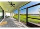 Spacious screened patio boasts beautiful lake view, perfect for relaxing or entertaining guests at 12816 Morning Mist Pl, Venice, FL 34293