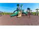 A fun playground at Solstice Wellen Park with slides and climbing equipment for children to enjoy at 12816 Morning Mist Pl, Venice, FL 34293