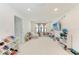 Spacious playroom with ample storage, a comfortable seating area, and plenty of room for activities at 12816 Morning Mist Pl, Venice, FL 34293