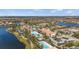Aerial view of a luxury community with multiple pools, clubhouse, and surrounding residences at 13486 Nobilio St, Venice, FL 34293