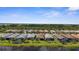 Lovely aerial scene of waterside homes, lanais, and lush landscaping creating a tranquil community setting at 13486 Nobilio St, Venice, FL 34293