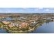 Aerial view of the expansive community surrounded by lakes, pools, and manicured landscaping at 13486 Nobilio St, Venice, FL 34293