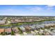 Picturesque aerial view of a community surrounding a waterway and offering beautiful water views at 13486 Nobilio St, Venice, FL 34293