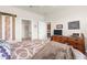 Bedroom featuring a comfortable bed and stylish dresser with a television at 13486 Nobilio St, Venice, FL 34293