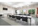 Bright classroom with tables, chairs, and natural light, suitable for workshops and learning activities at 13486 Nobilio St, Venice, FL 34293