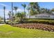 Islandwalk community sign surrounded by beautifully maintained landscaping and flowering plants at 13486 Nobilio St, Venice, FL 34293
