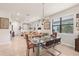 Spacious dining area open to living space, featuring contemporary lighting at 13486 Nobilio St, Venice, FL 34293
