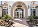 Inviting entrance to the Islandwalk Event Center, showcasing elegant architecture and manicured landscaping at 13486 Nobilio St, Venice, FL 34293
