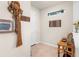 Inviting entryway with tile flooring, decorative art and a wooden table at 13486 Nobilio St, Venice, FL 34293
