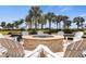 Relaxing fire pit area with comfortable seating and beautiful landscaping, perfect for enjoying evenings outdoors at 13486 Nobilio St, Venice, FL 34293