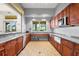 Convenient kitchen area with ample counter space, modern appliances, and a pass-through window, perfect for events at 13486 Nobilio St, Venice, FL 34293