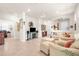 Spacious living room with comfortable seating, tile floors, open floor plan and ceiling fan at 13486 Nobilio St, Venice, FL 34293