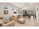 Open living area with tile flooring, neutral paint, lots of natural light and comfortable seating at 13486 Nobilio St, Venice, FL 34293
