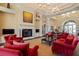 This stunning lobby features comfortable seating around a fireplace and cathedral ceilings at 13486 Nobilio St, Venice, FL 34293