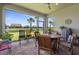 Enclosed patio with brick flooring, outdoor furniture, and views of the landscaped backyard at 13486 Nobilio St, Venice, FL 34293