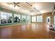 Versatile studio space with hardwood floors, large windows, and ample lighting, perfect for fitness or creative activities at 13486 Nobilio St, Venice, FL 34293