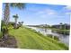 Beautiful landscaping and water view behind homes in this community at 13486 Nobilio St, Venice, FL 34293