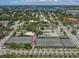 Expansive aerial view showcasing tennis and basketball courts, surrounded by lush landscapes and residential areas at 1531 Belfry Dr, Venice, FL 34292