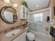 Well-maintained bathroom with a shower-tub combination and ample counter space at 1531 Belfry Dr, Venice, FL 34292