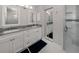 Updated bathroom features double sinks, granite counters, and glass shower at 1531 Belfry Dr, Venice, FL 34292
