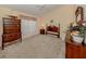 Bright bedroom featuring a ceiling fan, and traditional wooden furniture at 1531 Belfry Dr, Venice, FL 34292