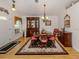 Cozy dining room with wood flooring, chandelier lighting, and traditional furnishings at 1531 Belfry Dr, Venice, FL 34292