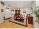 Inviting dining room featuring wood flooring, a formal dining set, and elegant decor at 1531 Belfry Dr, Venice, FL 34292