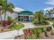The Waterford Sports Club entrance is framed by manicured landscaping and a covered entrance at 1531 Belfry Dr, Venice, FL 34292